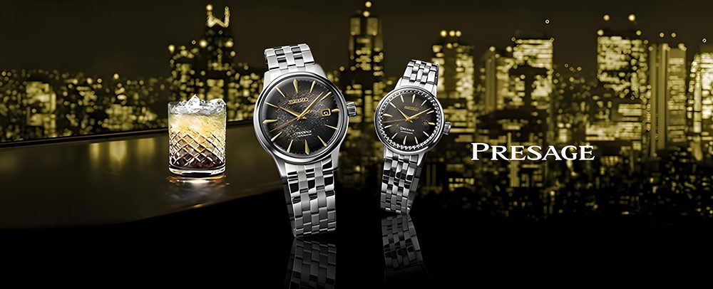 A sleek advertisement featuring two silver watches with black faces and roman numerals, set against a lit-up cityscape backdrop. A glass with a drink and ice is on the left. The word "Presage" is displayed prominently.